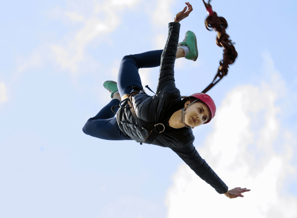 a woman bungee jumping