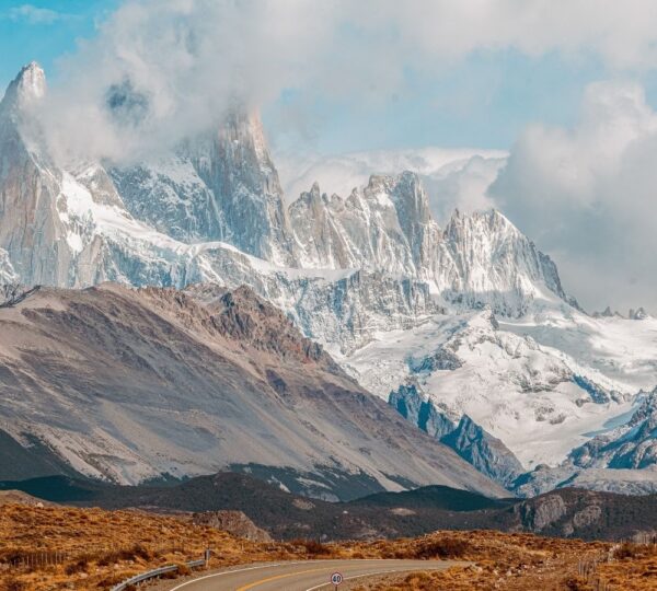 snowy mountains with desert scenery